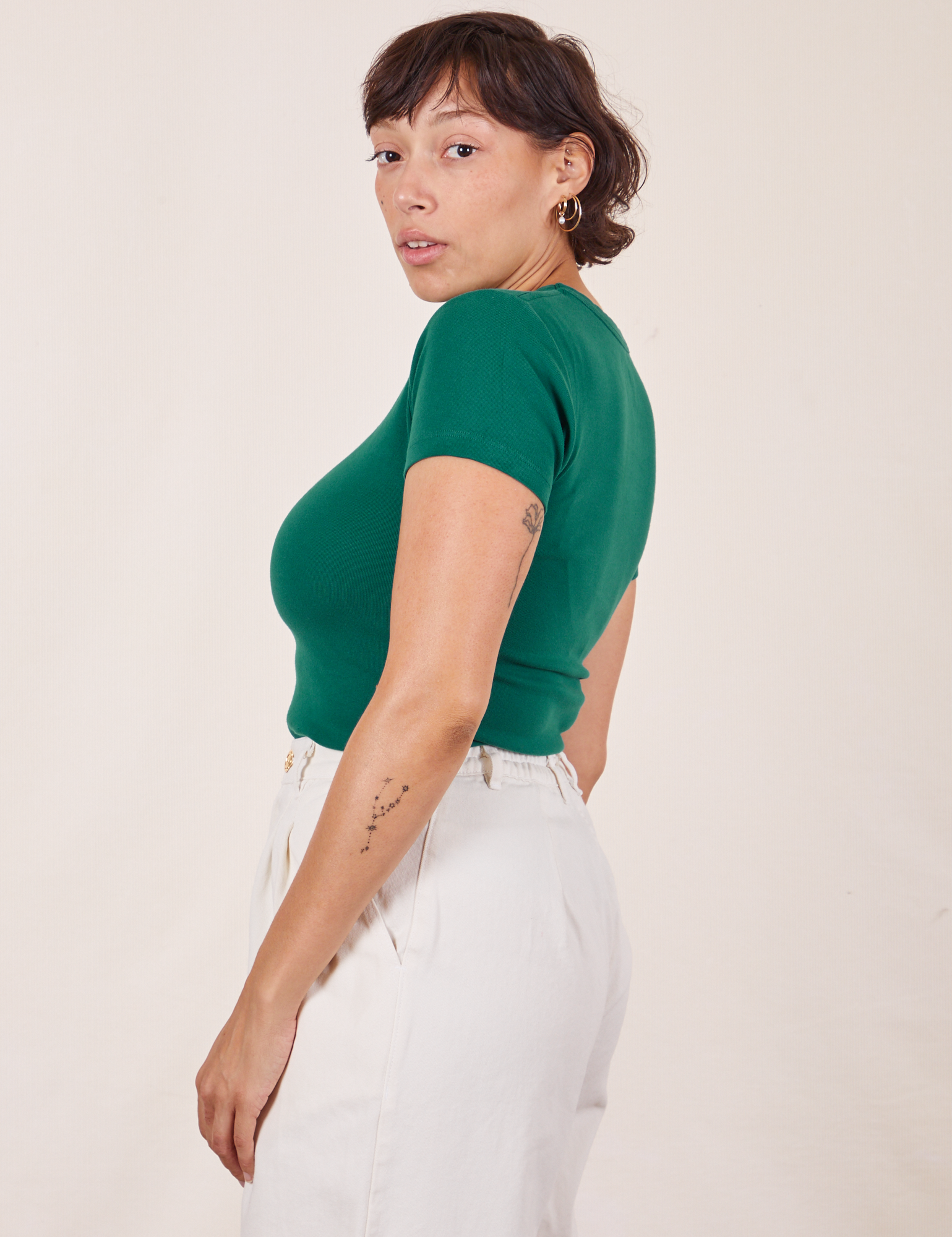 Side view of Baby Tee in Hunter Green worn by Tiara