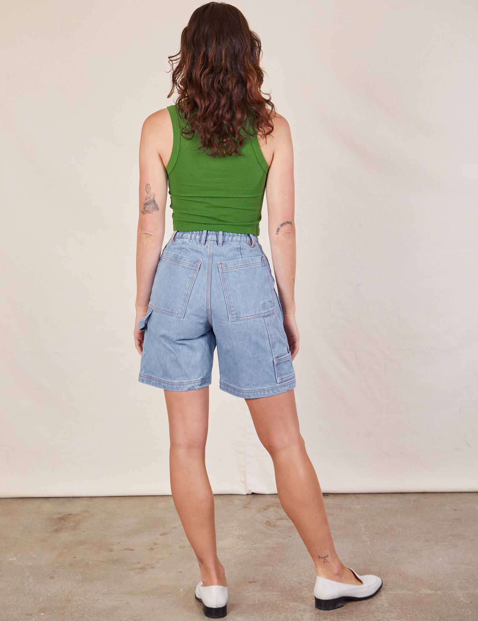 Back view of Carpenter Shorts in Light Wash and lawn green Cropped Tank