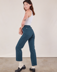 Angled back view of Work Pants in Lagoon and vintage tee off-white Cropped Tank on Alex