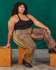 Morgan is wearing Leopard Work Pants and black Halter Top