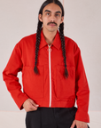 Anthony is 5’10 and wearing S Mechanic Jacket in Mustang Red