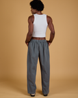 Back view of Baggy Mid-Rise Trousers in Slate Grey and vintage tee white on Jerrod