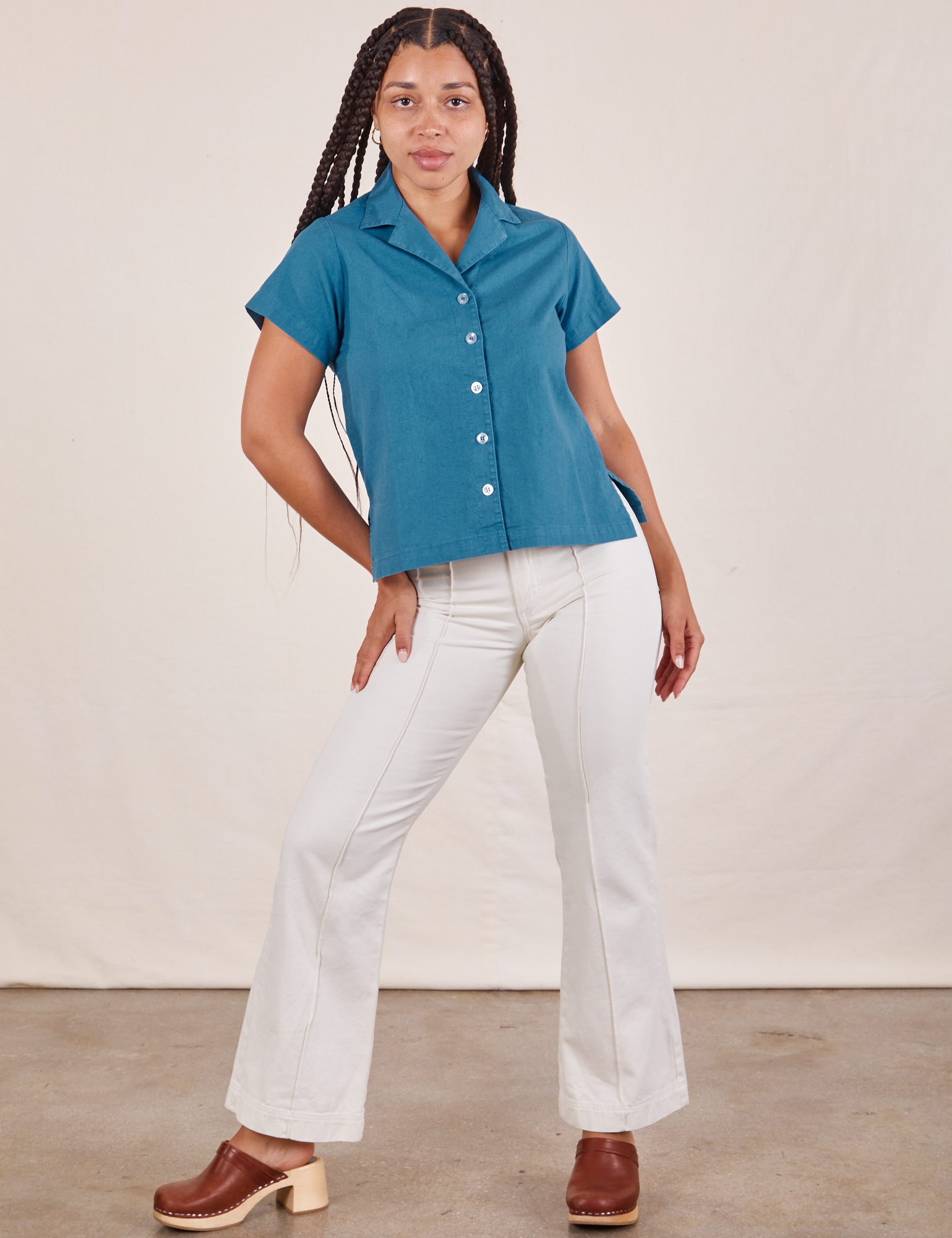Gabi is wearing Pantry Button-Up in Marine Blue and vintage tee off-white Western Pants
