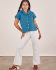 Gabi is wearing Pantry Button-Up in Marine Blue and vintage tee off-white Western Pants