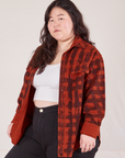 Angled view of Plaid Flannel Overshirt in Paprika on Ashley