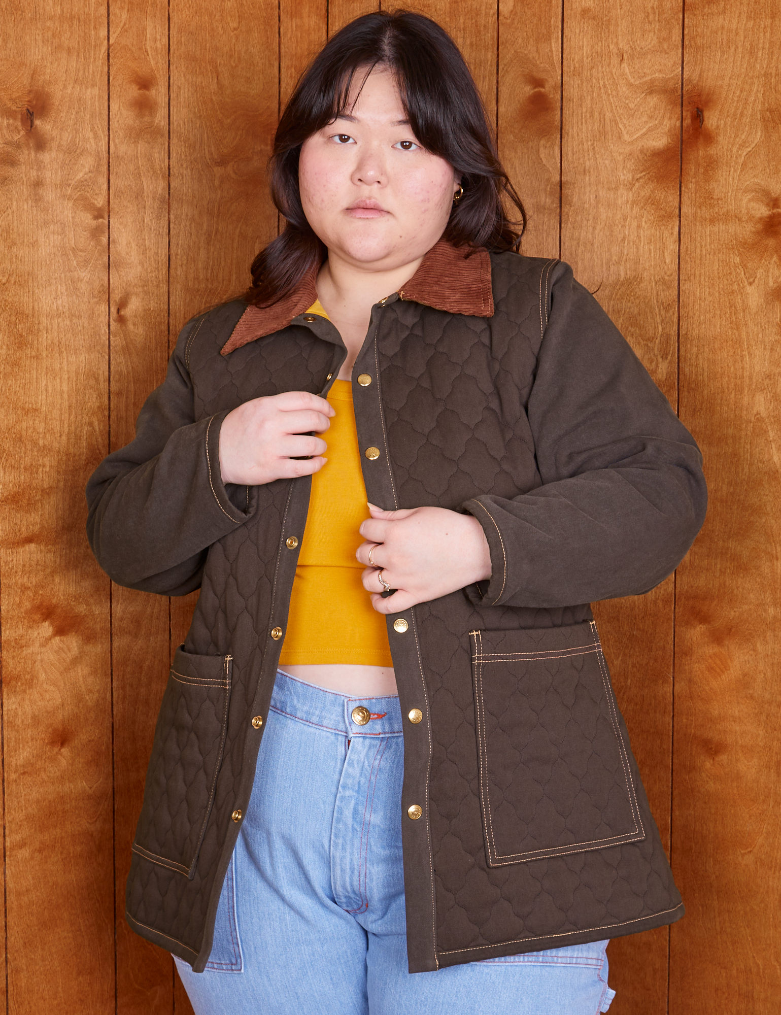 Ashley is wearing Quilted Overcoat in Espresso Brown