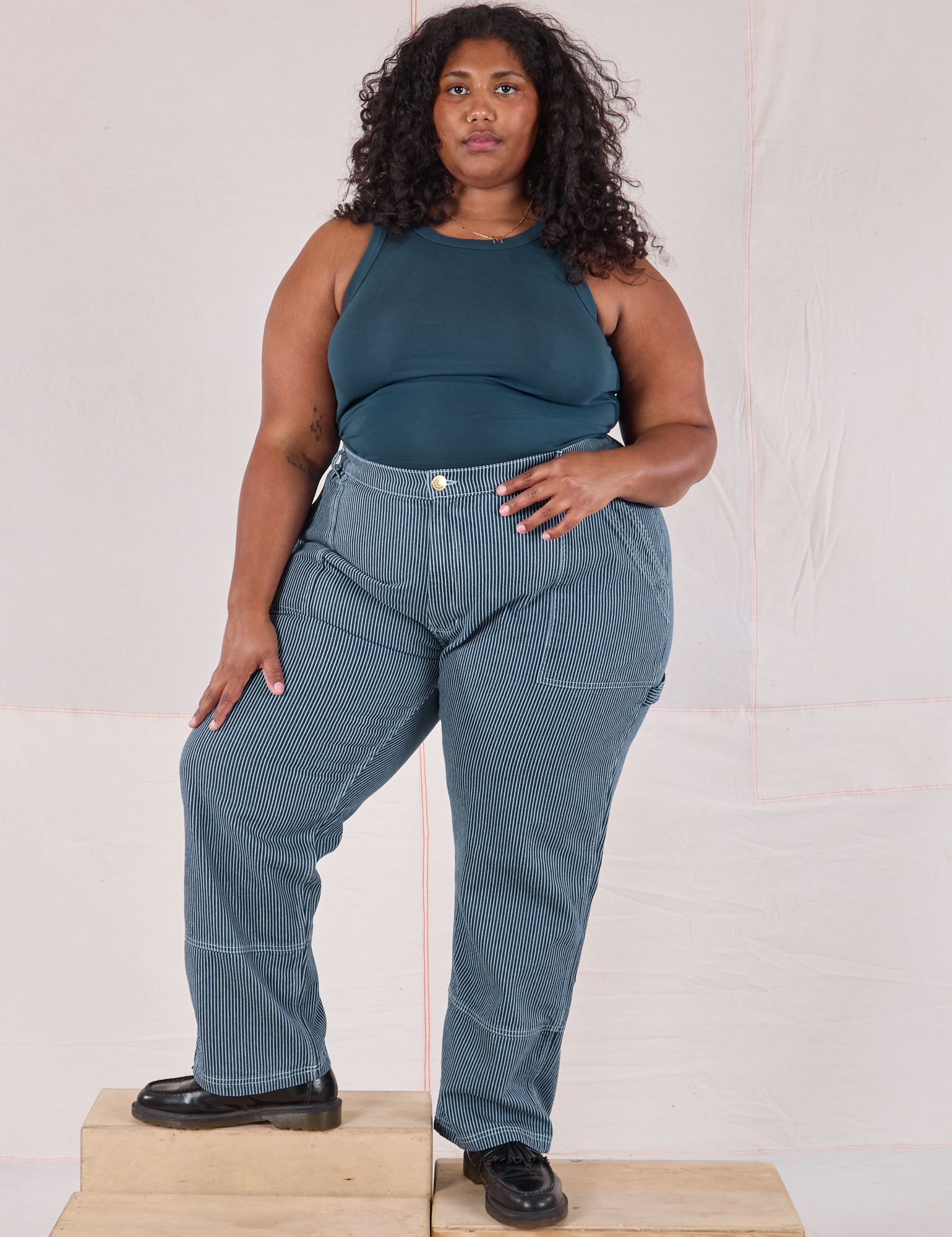 Morgan is 5’5’” and wearing 2XL Railroad Carpenter Jeans in Baby Blue