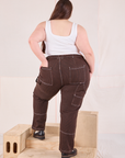 Back view of Railroad Carpenter Jeans in Fudgesicle Brown and vintage tee off-white Square Neck Tank on Marielena