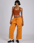 Drop Pocket Cargo Pants in Creamsicle Orange and burnt terracotta Cropped Tank on Kira