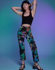 Alex is 5'8" and wearing XXS Work Pants in Rainbow Magic Waters paired with a black Cropped Tank