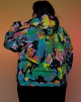 Oversized Hoodie in Rainbow Magic Waters back view on Sam