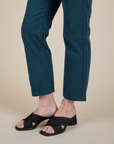 Short Sleeve Jumpsuit in Lagoon pant leg close up on Alex