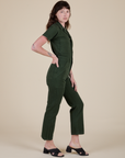 Side view of Short Sleeve Jumpsuit in Swamp Green on Alex
