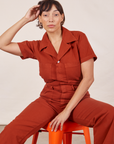 Tiara is wearing Short Sleeve Jumpsuit in Paprika
