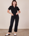 Alex is wearing Short Sleeve Jumpsuit in Basic Black