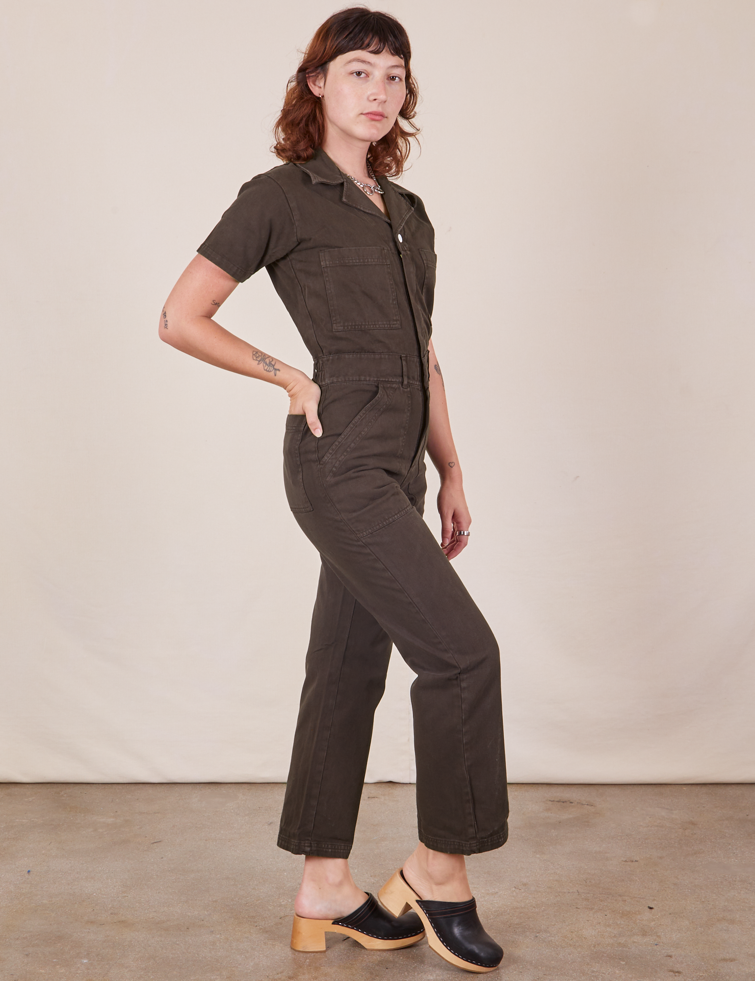 Side view of Short Sleeve Jumpsuit in Espresso Brown worn by Alex