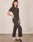 Side view of Short Sleeve Jumpsuit in Espresso Brown worn by Alex