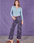 Scarlett is 5'9" and wearing XS Marble Splatter Work Pants in Nebula Purple paired with baby blue Long Sleeve Fisherman Polo