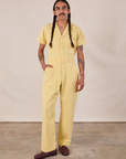Anthony is 5'10" and wearing S Short Sleeve Jumpsuit in Butter Yellow
