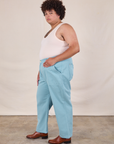 Side view of Work Pants in Baby Blue and Tank Top in vintage tee off-white on Miguel