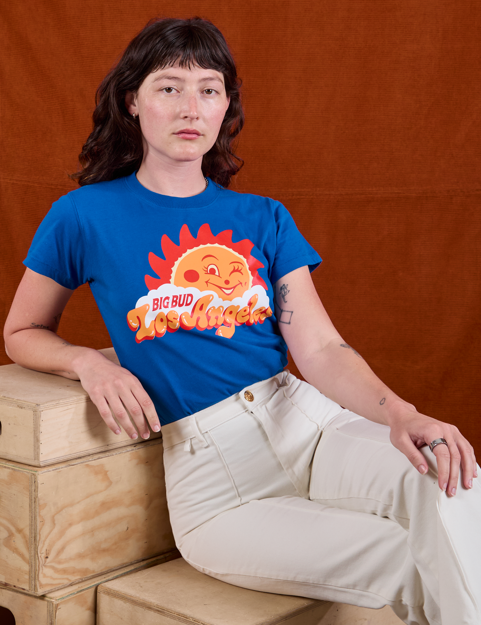 Alex is wearing Sunny Los Angeles Tourist Tee and vintage tee off-white Western Pants