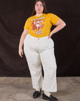 Marielena is wearing Wicker Park Tourist Tee and vintage tee off-white Western Pants