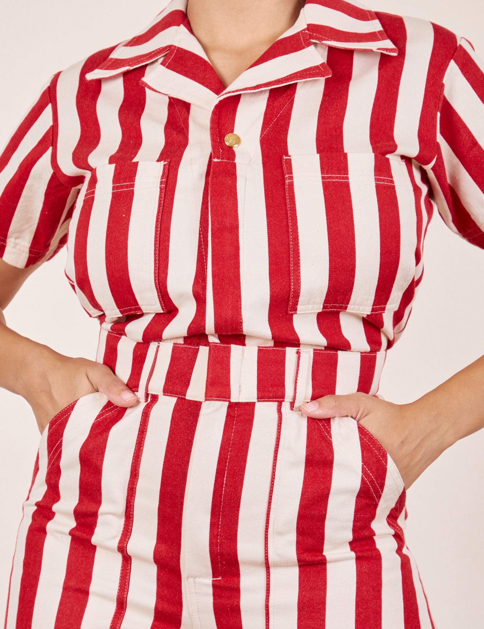 Cherry Stripe Jumpsuit front close up on Tiara. She has both hands in the front pockets.