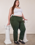 Angled front view of Work Pants in Swamp Green and Cropped Tank Top in vintage tee off-white on Marielena