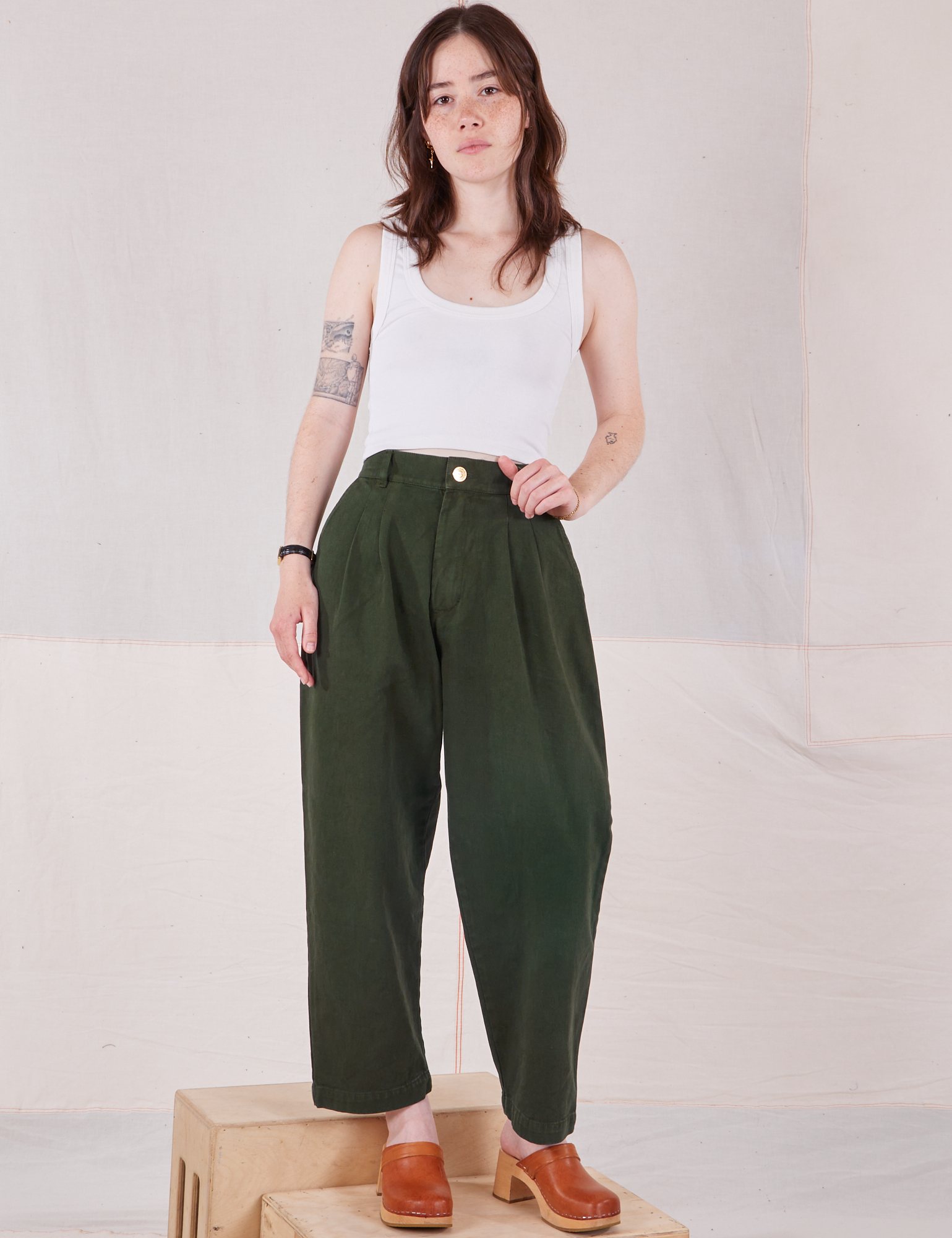 Hana is 5&#39;3&quot; and wearing XXS Petite Heavyweight Trousers in Swamp Green paired with vintage tee off-white Cropped Tank