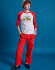 Quinn is wearing Taxi Raglan Tee in NYC and mustang red Work Pants