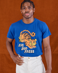 Isaac is wearing BBP Tiger Tee tucked into vintage tee off-white Western Pants