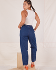 Back view of Denim Trouser Jeans in Dark Wash and Tank Top in vintage tee off-white worn by Gabi