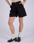 Front close up of Pleated Trouser Shorts in Basic Black on Alex