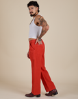 Side view of Work Pants in Mustang Red and Cropped Tank in Vintage Tee White on Jesse