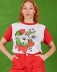 Tiara is wearing Anniversary Tee in Strawbaby tucked into mustang red Work Pants