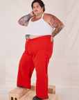 Side view of Bell Bottoms in Mustang Red and Halter Top in vintage tee off-white worn by Sam