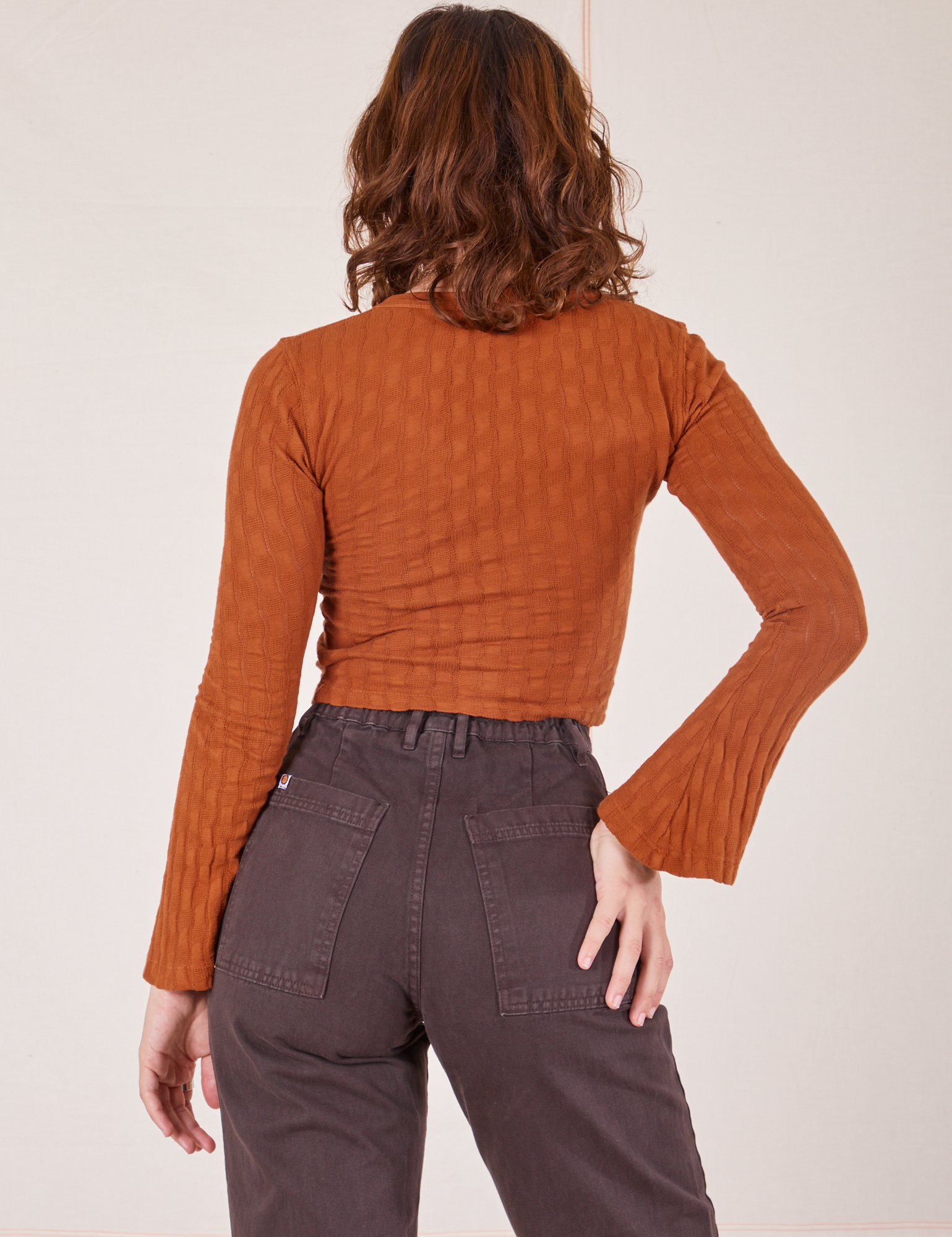 Back view of Bell Sleeve Top in Burnt Terracotta and espresso brown Western Pants