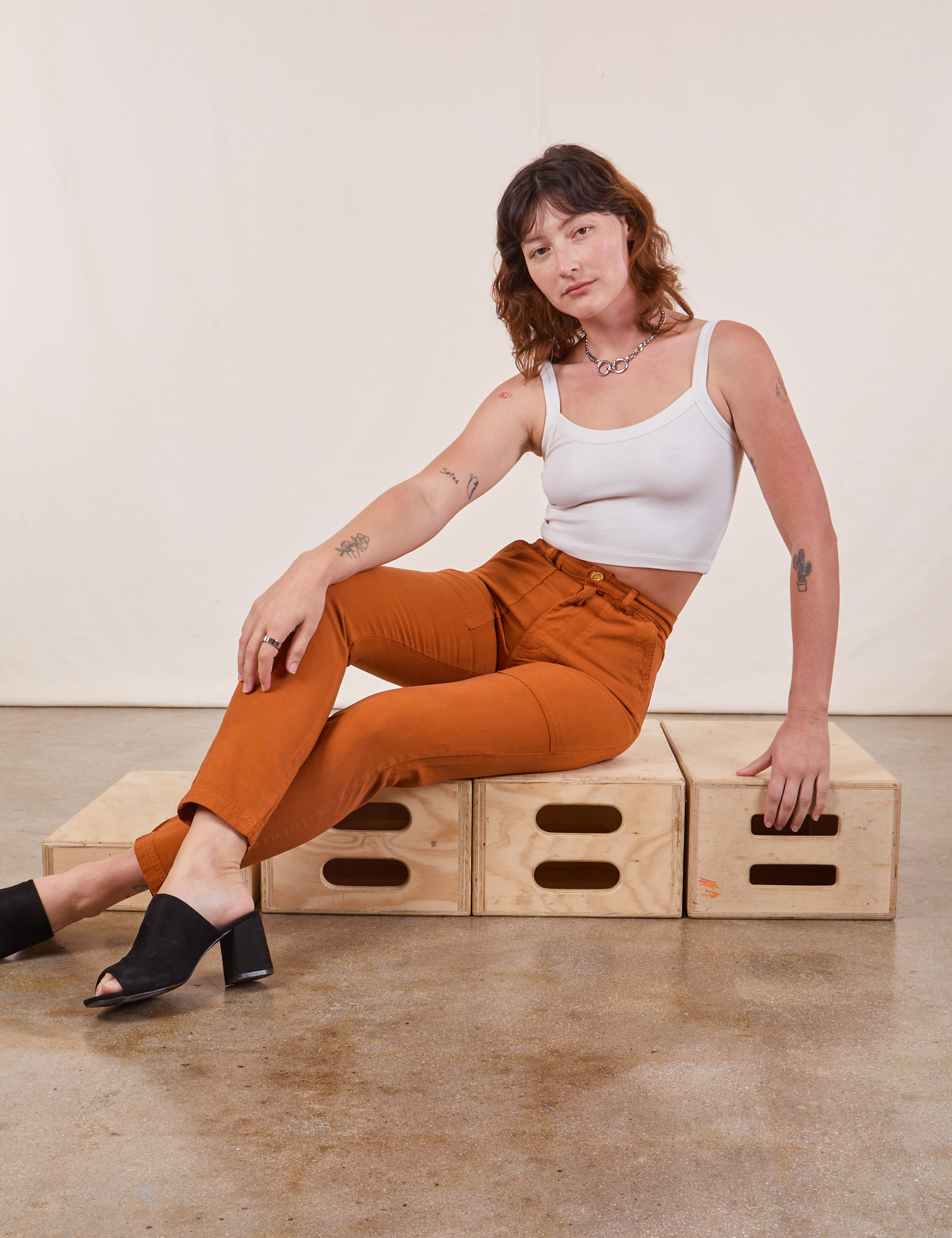 Alex is wearing Pencil Pants in Burnt Terracotta and Cropped Cami in vintage tee off-white