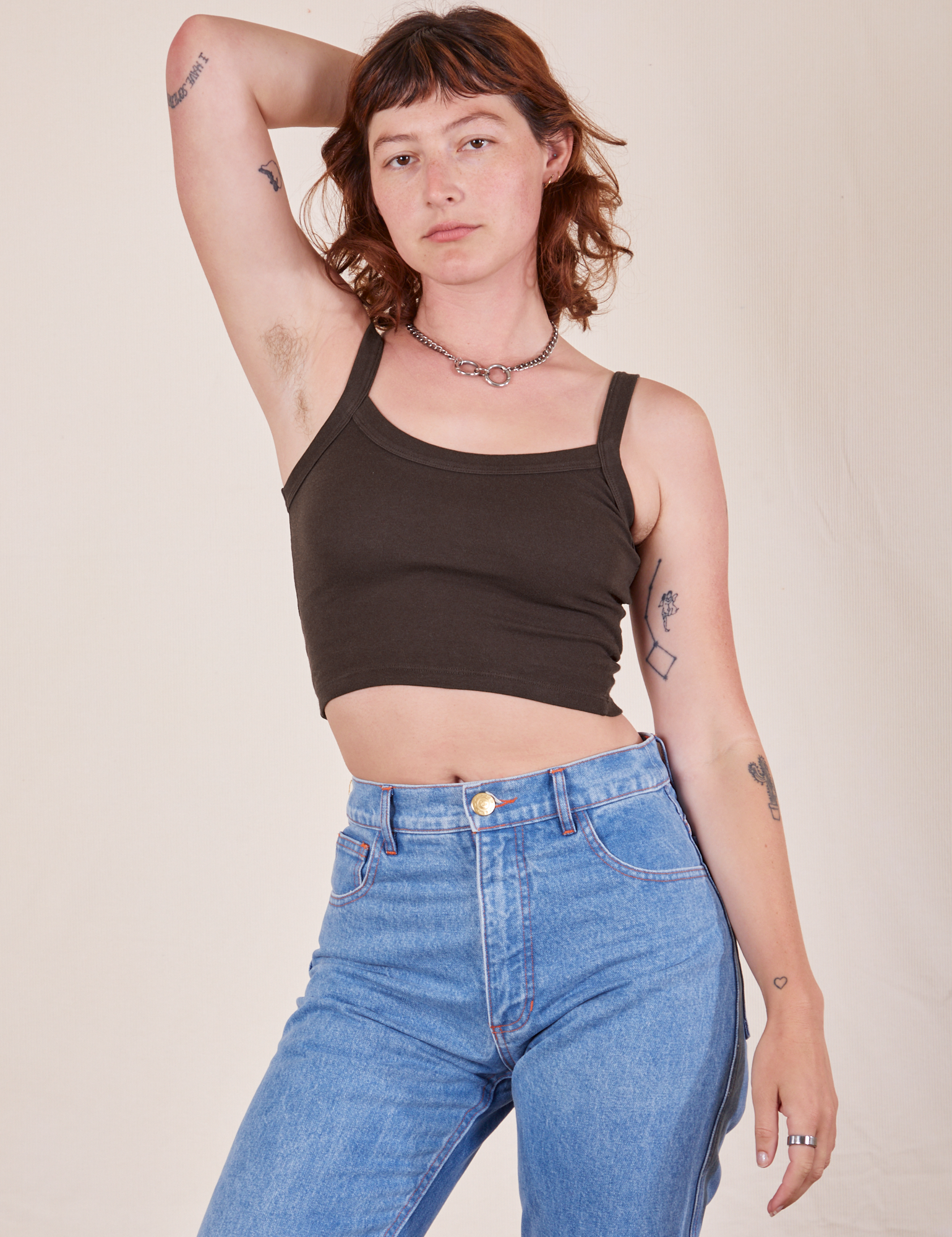 Alex is 5&#39;8&quot; and wearing P Cropped Cami in Espresso Brown paired with light wash Frontier Jeans