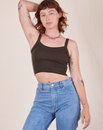 Alex is 5'8" and wearing P Cropped Cami in Espresso Brown paired with light wash Frontier Jeans