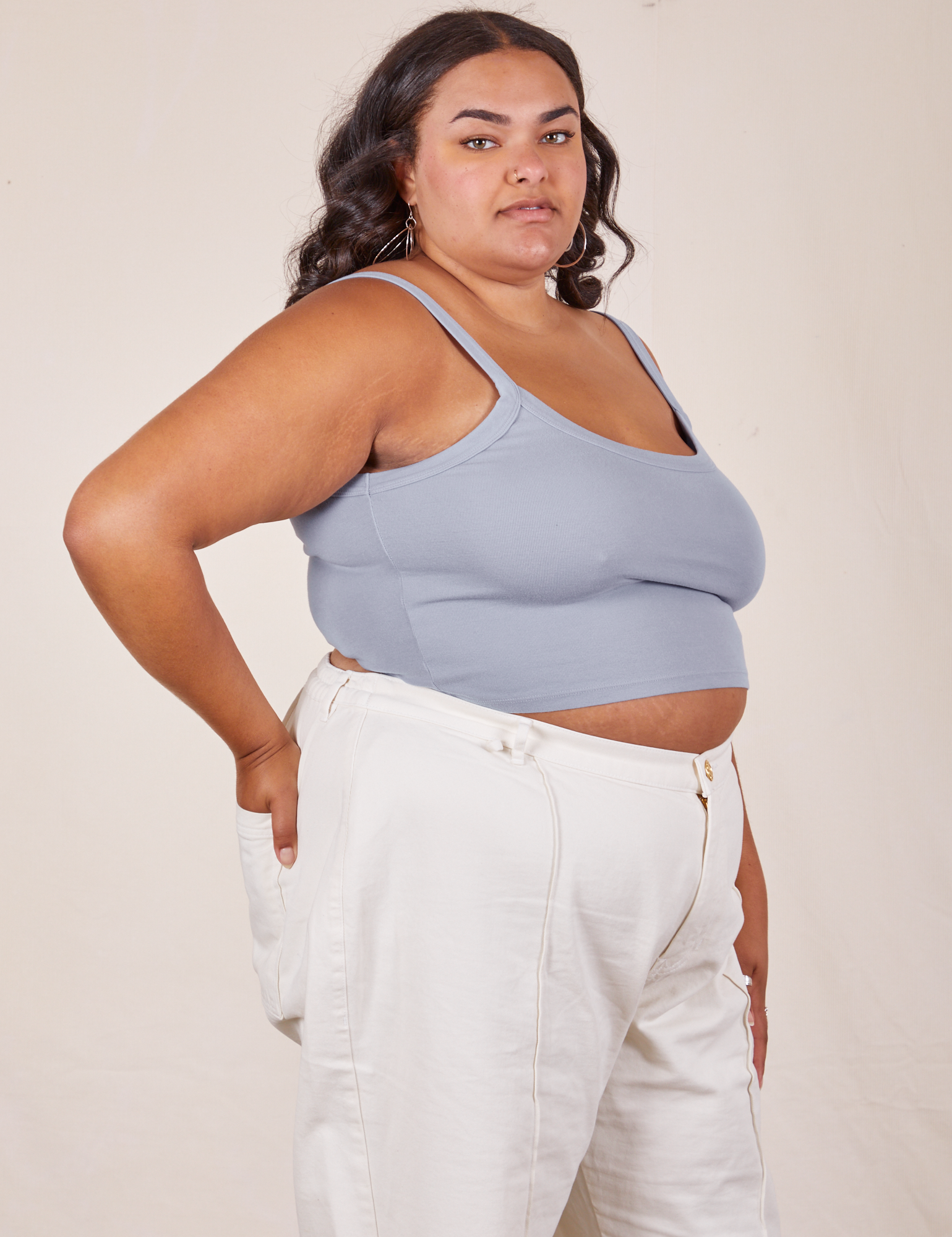 Angled view of Cropped Cami in Periwinkle and vintage tee off-white Western Pants worn by Alicia