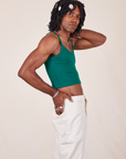 Side view of Cropped Cami in Hunter Green and vintage tee off-white Western Pants on Jerrod