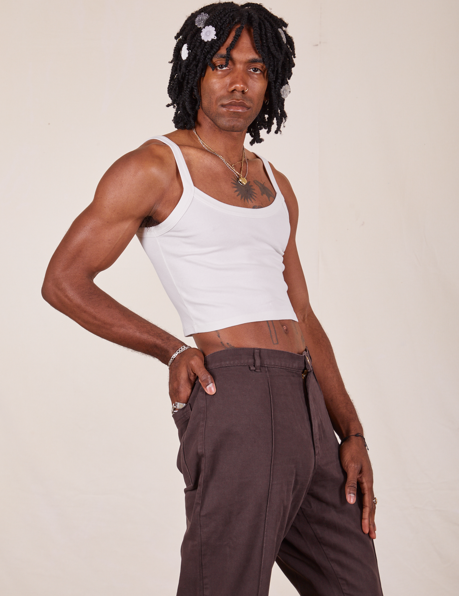 Angled view of Cropped Cami in Vintage Tee Off-White and espresso brown Western Pants worn by Jerrod