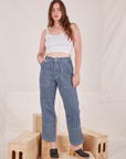 Allison is 5'10" and wearing S Carpenter Jeans in Railroad Stripes paired with Cropped Cami in vintage tee off-white