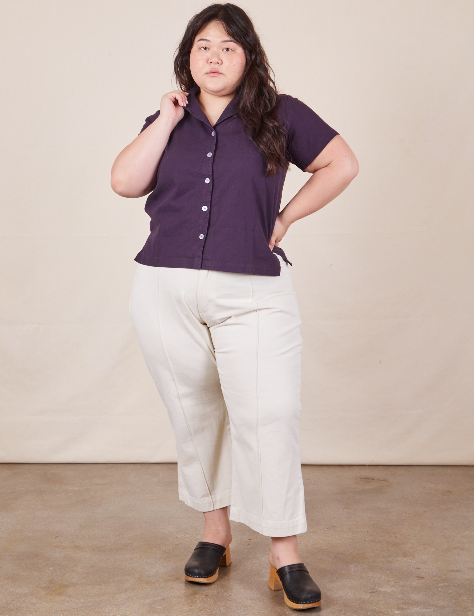 Alex is wearing Pantry Button-Up in Nebula Purple and vintage tee off-white petite Western Pants