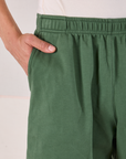 Close up of Anthony's hand in the pocket of Easy Shorts in Dark Emerald Green