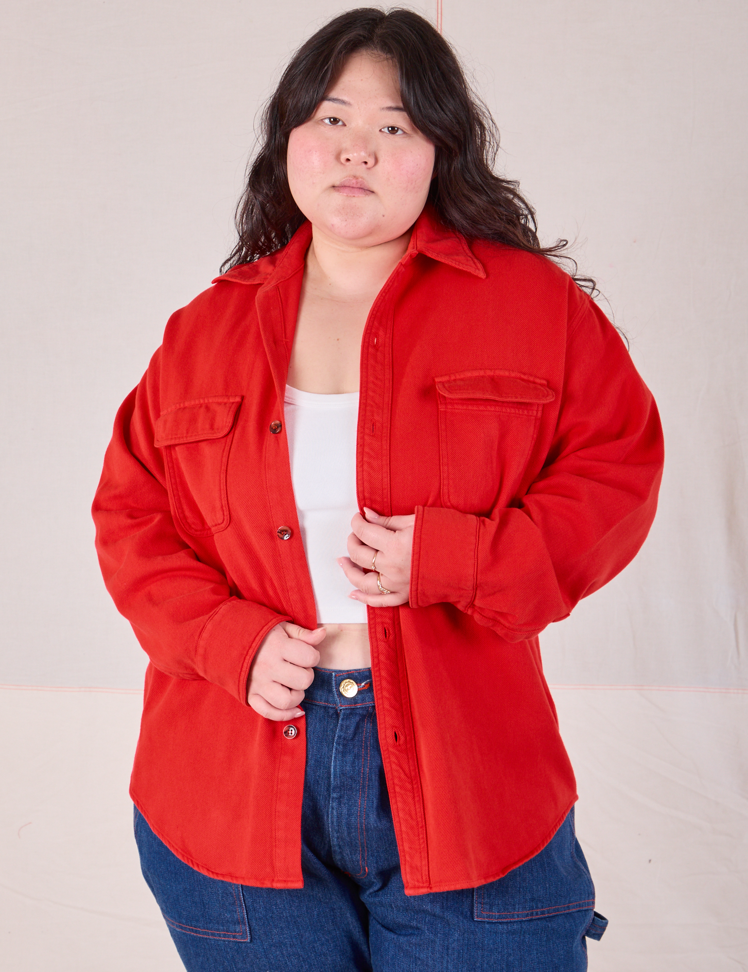 Ashley is 5'7" and wearing L Flannel Overshirt in Mustang Red