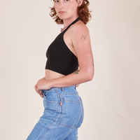 Side view of Halter Top in Basic Black and light wash Frontier Jeans worn by Alex