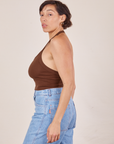 Side view of Halter Top in Fudgesicle Brown and light wash Sailor Jeans worn by Tiara