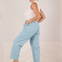 Side view of Heavyweight Trousers in Baby Blue and vintage off-white Sleeveless Turtleneck worn by Tiara
